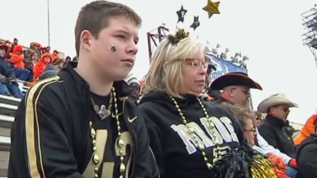Jake Wallman was hailed as one half of the first set of millenium twins born in the United States. He spent his 13th birthday cheering on his idol at the Heart of Dallas Bowl.