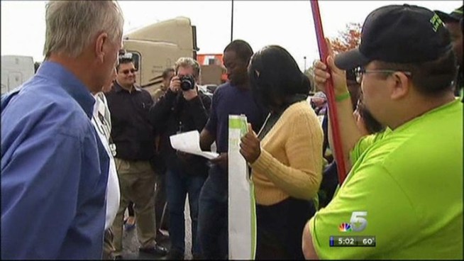 Dozens of marchers in front of local Walmarts as part of a nationwide protest.