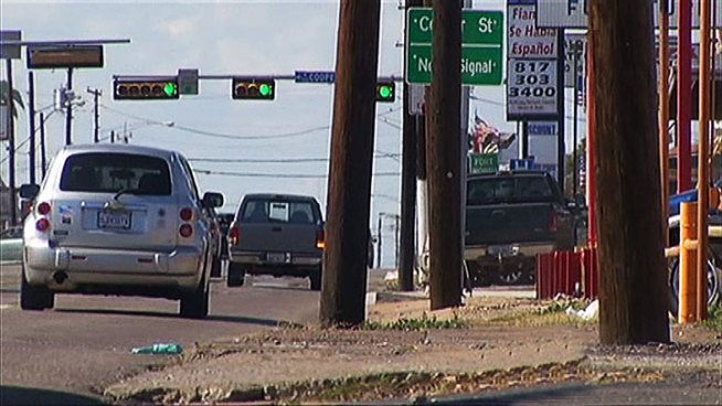 Division Street in Arlington is lined with utility poles that local businesses and groups are pushing to have removed.
