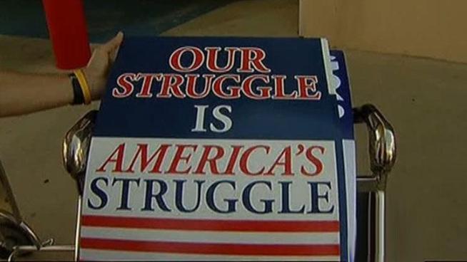 Employees from American Airlines picket outside of DFW Airport's Terminal D Monday, protesting the airline petitioning a U.S. Bankruptcy Court to allow them to throw out union contracts.