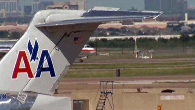American Airline's parent company says it lost $162 million in the third quarter.
