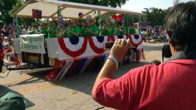 Tens of thousands of parade watchers withstood the heat to watch the city's annual Independence Day Parade.