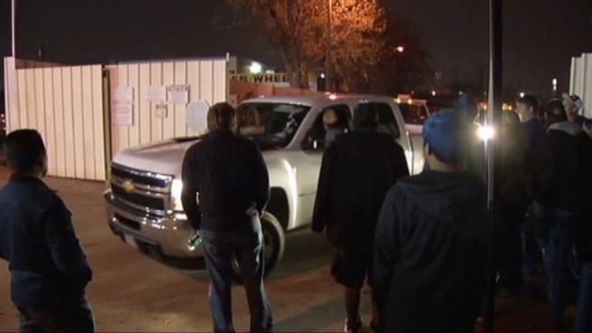 Dozens of vehicles of people who watched high school football at Cowboys Stadium towed from a store parking lot.