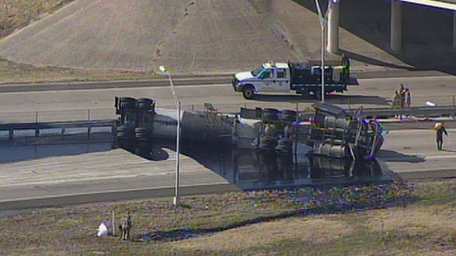 The Texas Department of Transportation said it will take up to 8 hours to clean up after a tanker truck carrying asphalt crashed on North Main Street at Loop 820 in North Fort Worth.
