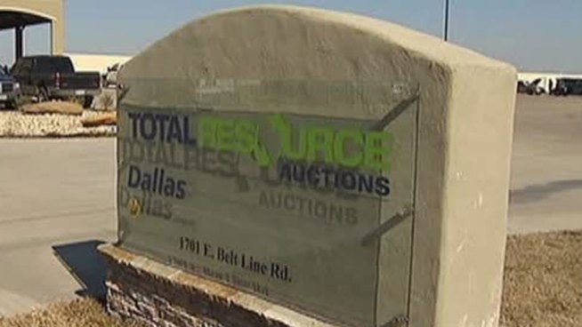 Nine people are injured after a vehicle crashed through an aluminum wall at an auto auction in Wilmer, TX.