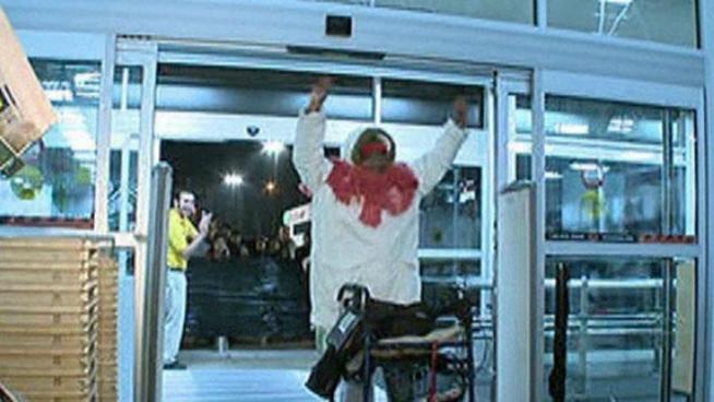 Black Friday shoppers at a Dallas Best Buy waited to allow a woman with a walker to enter the store first when doors opened for shopping.