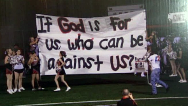 Texas Attorney General Greg Abbott, with the support of Gov. Rick Perry, is siding with a group of Texas cheerleaders that has filed a lawsuit after being told to stop using Bible verses on banners at football games.