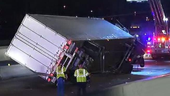 Garland police say the trucker sideswiped a guardrail, causing him to lose control.