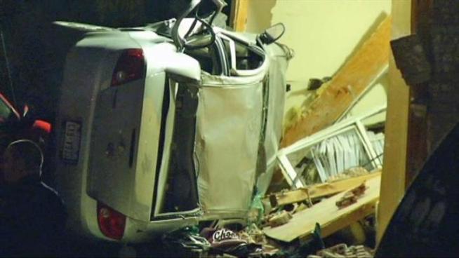 One person is dead and four were injured when a car slammed into a home on Loving Avenue in Fort Worth.