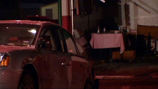 A grandmother was killed after a car struck a pole and a minivan before slamming into the pizza restaurant she was at with her daughter and grandson.