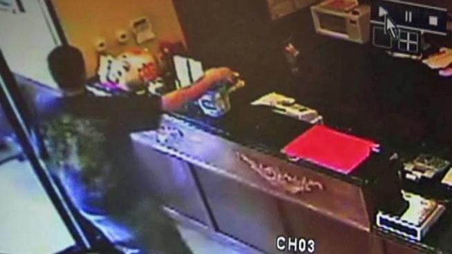 Mesquite police are searching for the man caught on surveillance video stealing a jar filled with donations for a cancer charity from a restaurant counter.