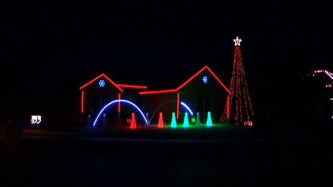A Flower Mound man has synchronized his display of 10,000 lights to five different Christmas songs.