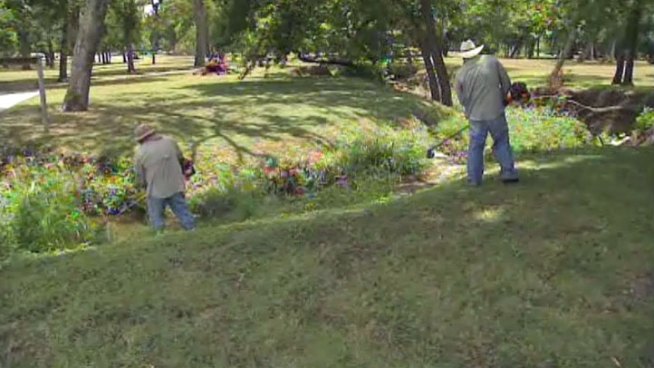 Since the City of Dallas started using private contractors to keep city parks clean, residents say they have seen an improvement, but city leaders say those workers should have health insurance.