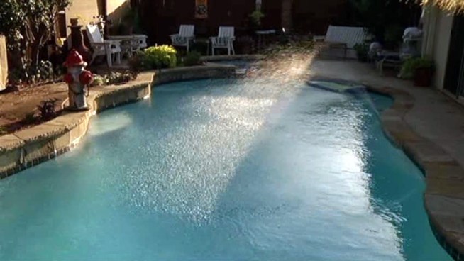 Pool experts say the best way to bring down your pool's temperature is to keep the water moving with a waterfall or fountain.