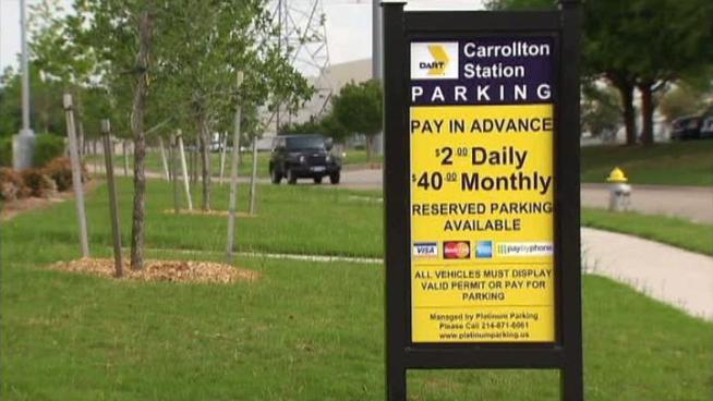 DART has launched a two-year pilot program at two stations that charges commuters outside the agency's service area $2 per day to park.