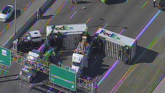 A Fed-Ex big-rig pulling tandem-trailers overturned on the northbound lanes of Interstate 35E at Commonwealth in Dallas Wednesday, closing the highway.