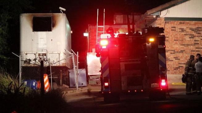 Fort Worth firefighters found the body of a man inside an 18-wheeler trailer that caught fire Tuesday morning behind The Rig steakhouse.