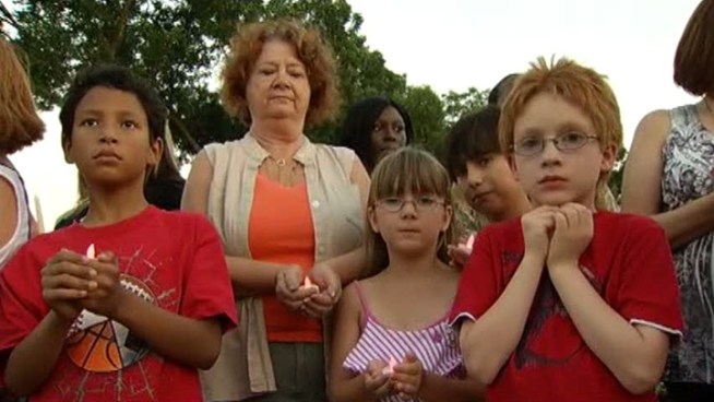 Friends and family of the victims held a vigil for the two people killed in the fire at the Tanglewood Apartments.