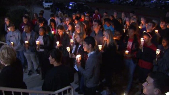 Frisco residents came together at a candlelight vigil for the victims of the Newtown, Conn., school shooting, as high school football fans at a championship game say their thoughts and prayers are with the victims and the survivors.