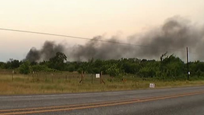 An oil battery fire that sent a thick plume of black smoke into the morning sky Wednesday is now under control, according to fire officials.