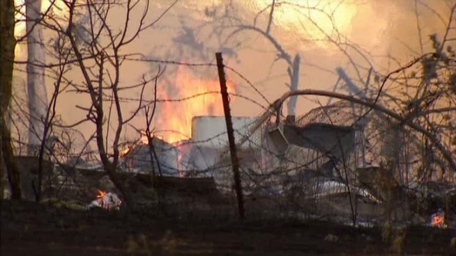 Fire crews say a Johnson County grass fire destroyed an abandoned home in Joshua.