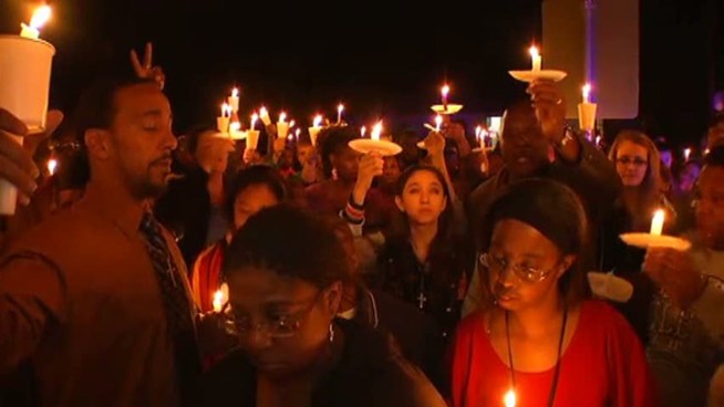 Loved ones and Greenville residents remember Moore during a candlelight vigil at the bus stop where she was last seen as questions are raised about how police handled her disappearance.
