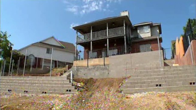 A couple is making changes to a Southwest Dallas home where heavy rains swept away the backyard in 2009, leaving the house standing on a small cliff.