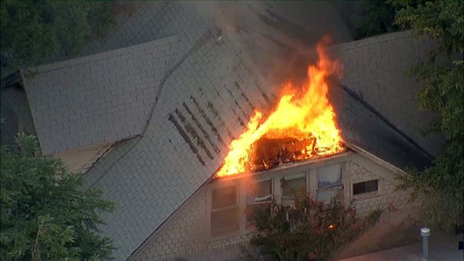 Dallas firefighters battled a house fire Tuesday night. No one was injured in the fire.