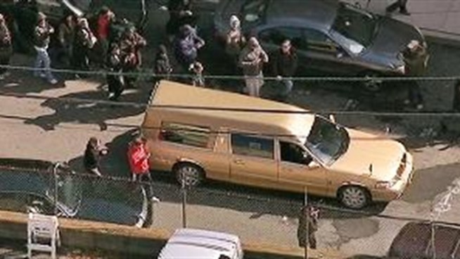 The hearse carrying the body of Whitney Houston leaves the Whigham Funeral Home in Newark, headed to Fairview Cemetery in Westfield, N.J.