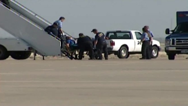 Several passengers restrained a Jet Blue pilot who apparently lost control of himself during a flight from New York to Las Vegas. The pilot is getting medical care in Amarillo, where the plane touched down after the co-pilot declared an in-flight emergency.