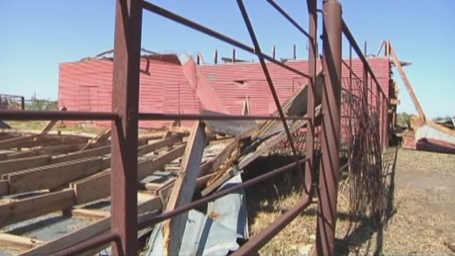 Sunday's storm damaged homes and destroyed barns and fences near a stretch of South Branch Road in Krum.