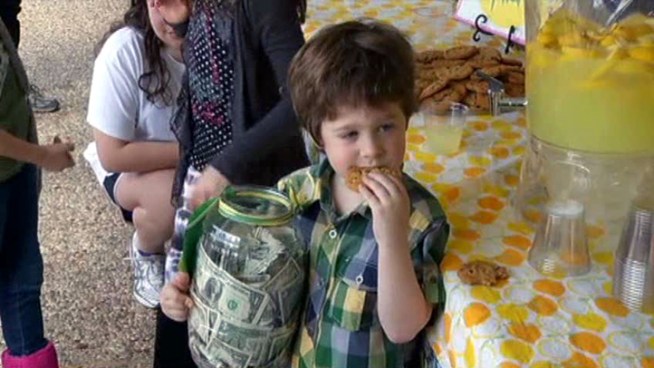 A small charge for some lemonade helps raise money for the victims of the disaster in <a title=