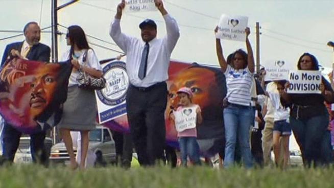 NAACP members march to Cowboys Stadium to rally for a change in popular Arlington Street.  They would like to see Divsion renamed after Civil Rights Leader Martin Luther King Jr.