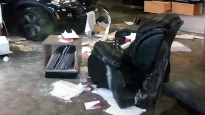 A sport utility vehicle crashed through a Dallas nail salon, injuring a pedicure customer whose chair was thrown into a neighboring salon.