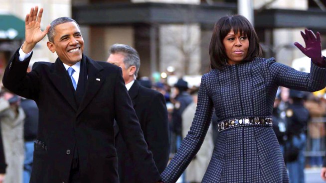President Barack Obama and first lady Michelle Obama walk down Pennsylvania Avenue during the 57th Presidential Inauguration parade.
