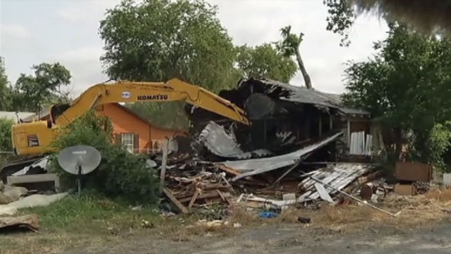 National Guard troops demolished 50 homes in Dallas as part of Operation Crackdown, which razes abandoned homes that are used as drug houses.