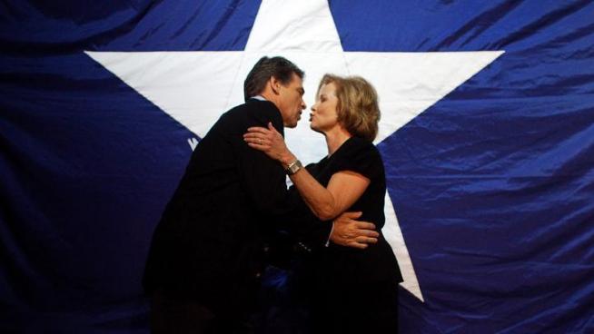 Gov. Rick Perry tells reporters in Austin that his wife is encouraging him to 
