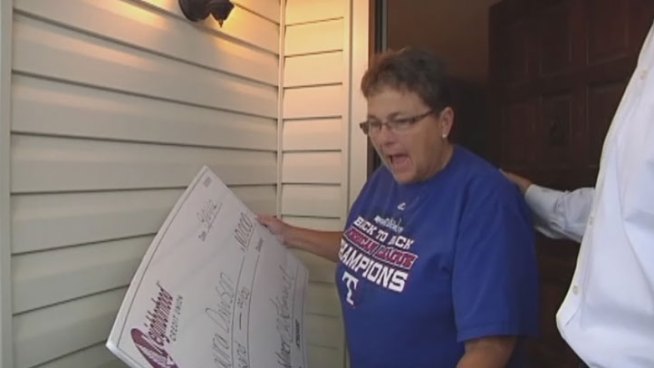 On Tuesday, Laura Dawson was surprised with a giant check, her reward for having a savings account and being diligent with her finances.