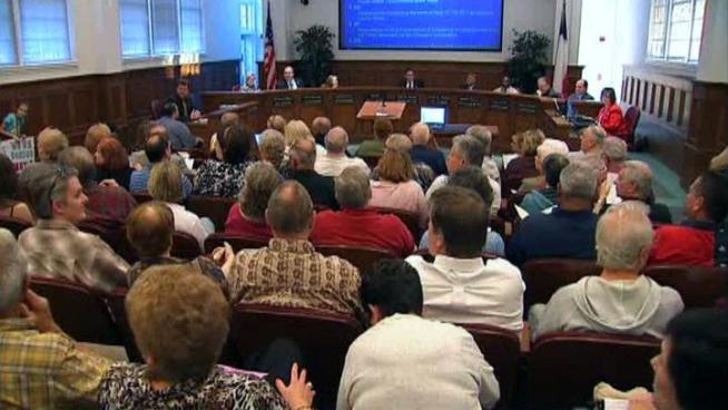 Mayor John Harper didn't attend council meeting that included an agenda item calling for his resignation.
