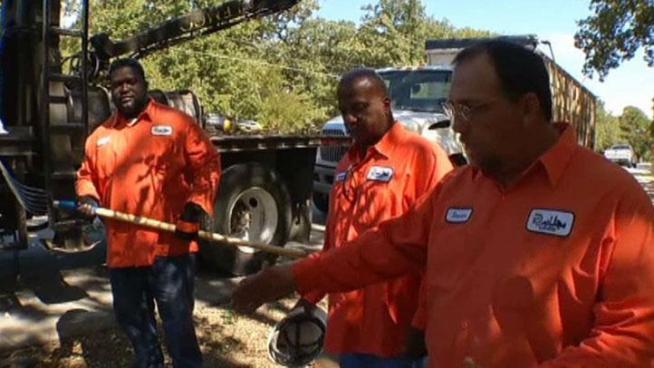 Three sanitation workers for the City of Dallas were honored for saving a little boy's life when they saw two dogs attacking him.