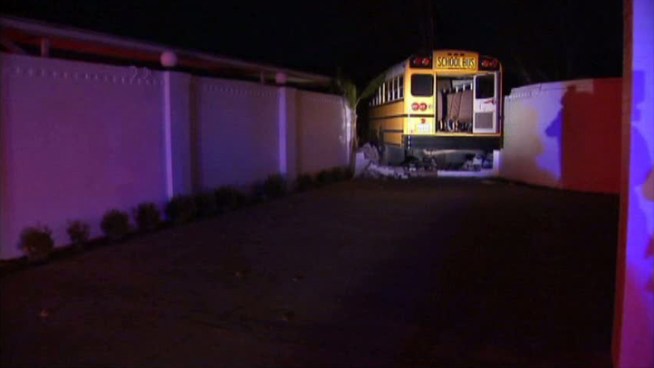 Police say a Fort Worth school bus crashed into a home after another vehicle pulled in front of the bus.