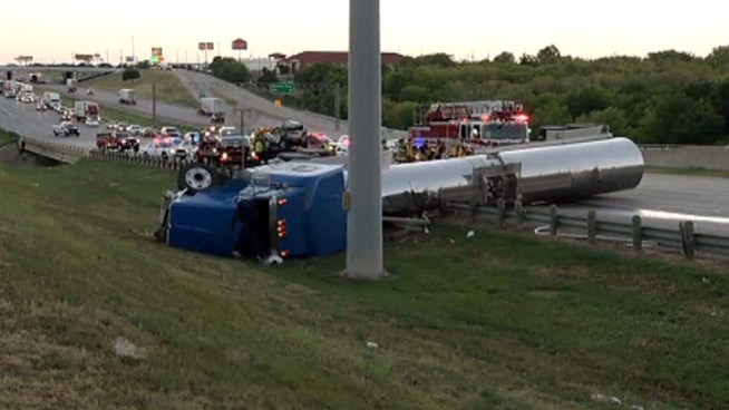 A semitrailer with a flammable liquid flipped over in a wreck on Interstate 20 in Dallas.