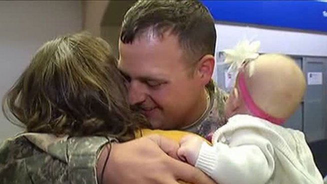 Lila Jackman, 7 months old, met her father for the first time at DFW Airport when he returned home on leave from active duty overseas.