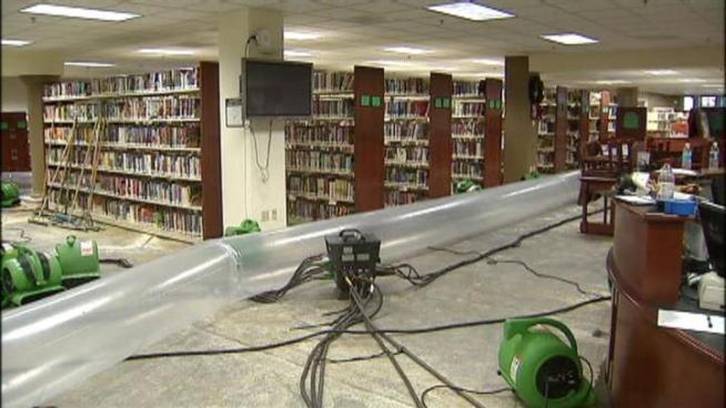 Ruined carpets and dehumidifying machines are what's left of a flood inside the Southlake Town library. The damage is the result of a fire protection water line break.