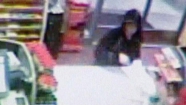 Plano police have released surveillance footage of a woman using a credit card that was stolen from a mother in a car break-in during a fundraiser for her sick child.