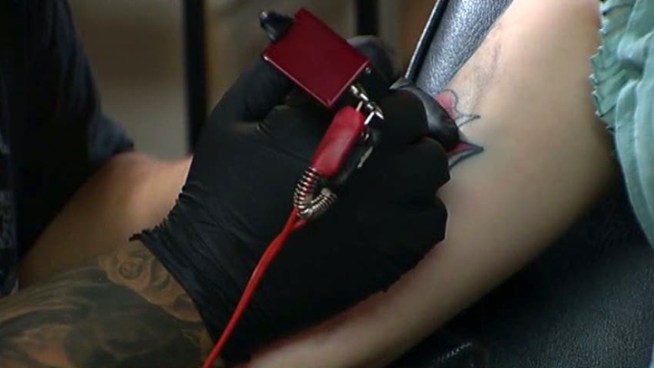 A Fort Worth tattoo artist was arrested on suspicion of tattooing a 16-year-old girl.