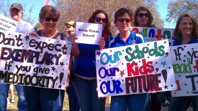 Thousands of teachers rallied against budget cuts that may cost them their jobs Saturday in <a title=