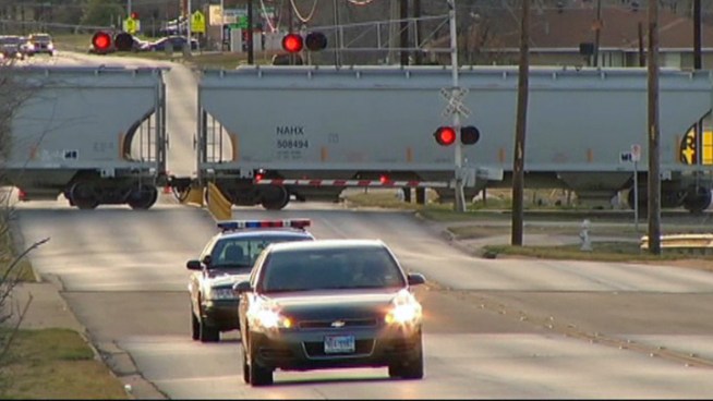 A teenager was hit and killed by a freight train on Sunday after crossing between cars of a stopped train on another track.