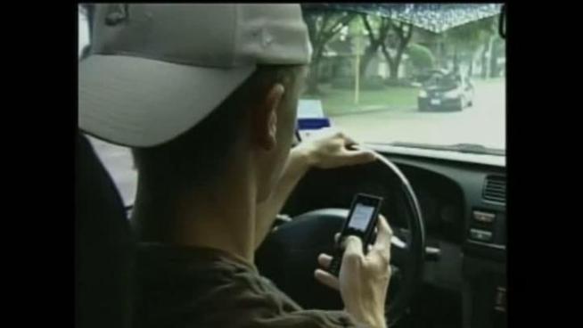 Federal accident investigators recommended states ban the use of cell phones and other electronic devices by all drivers except in emergencies.