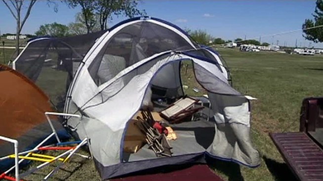 High-winds caught a few tents, but the high spirits of some early campers at Texas Motor Speedway couldn't be blown away by the gusty weather.